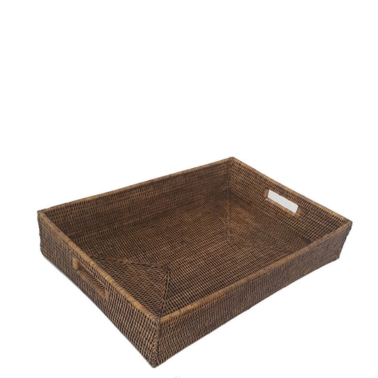 A rectangular brown rattan serving tray with handles on the sides.