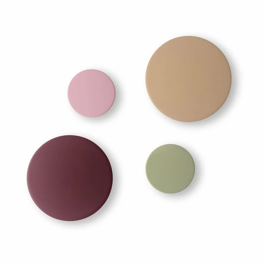 Four round wall hooks in pink, beige, purple, and green