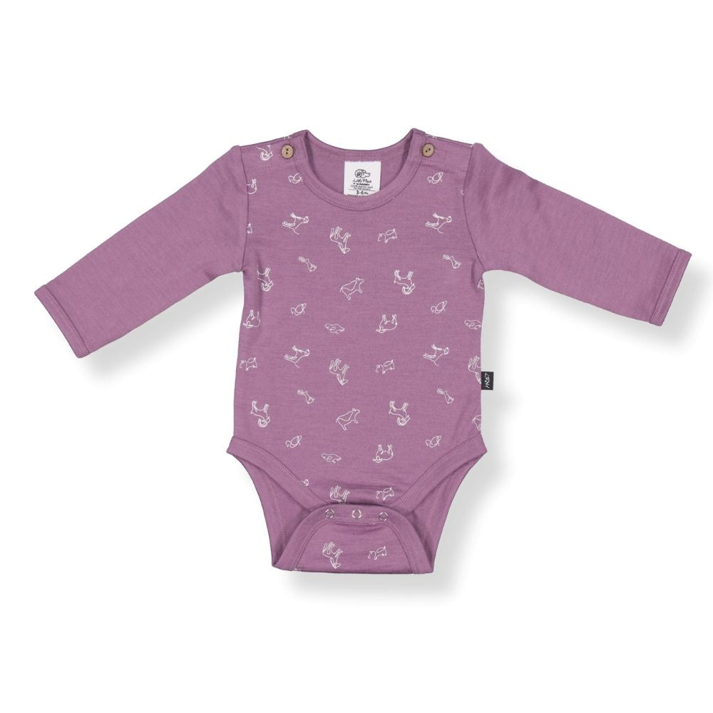 A mauve-colored long-sleeved baby bodysuit with animal patterns and snaps at the hem
