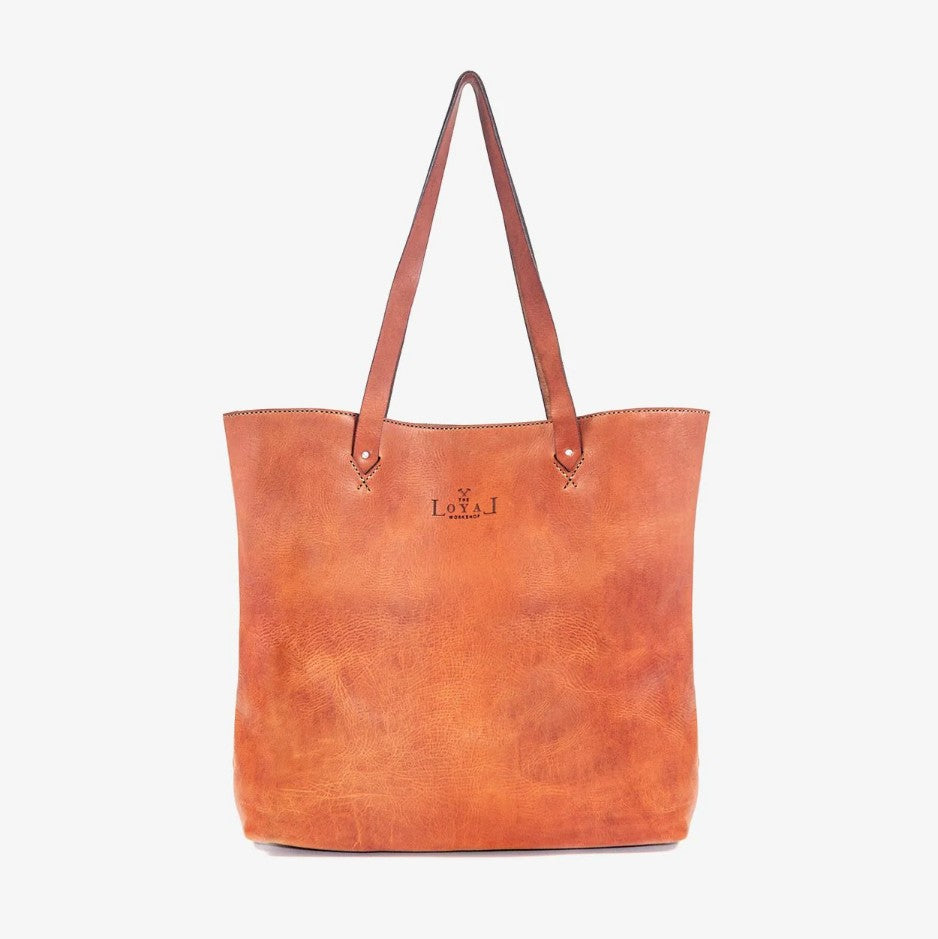 Brown leather tote bag with visible brand logo loyal 