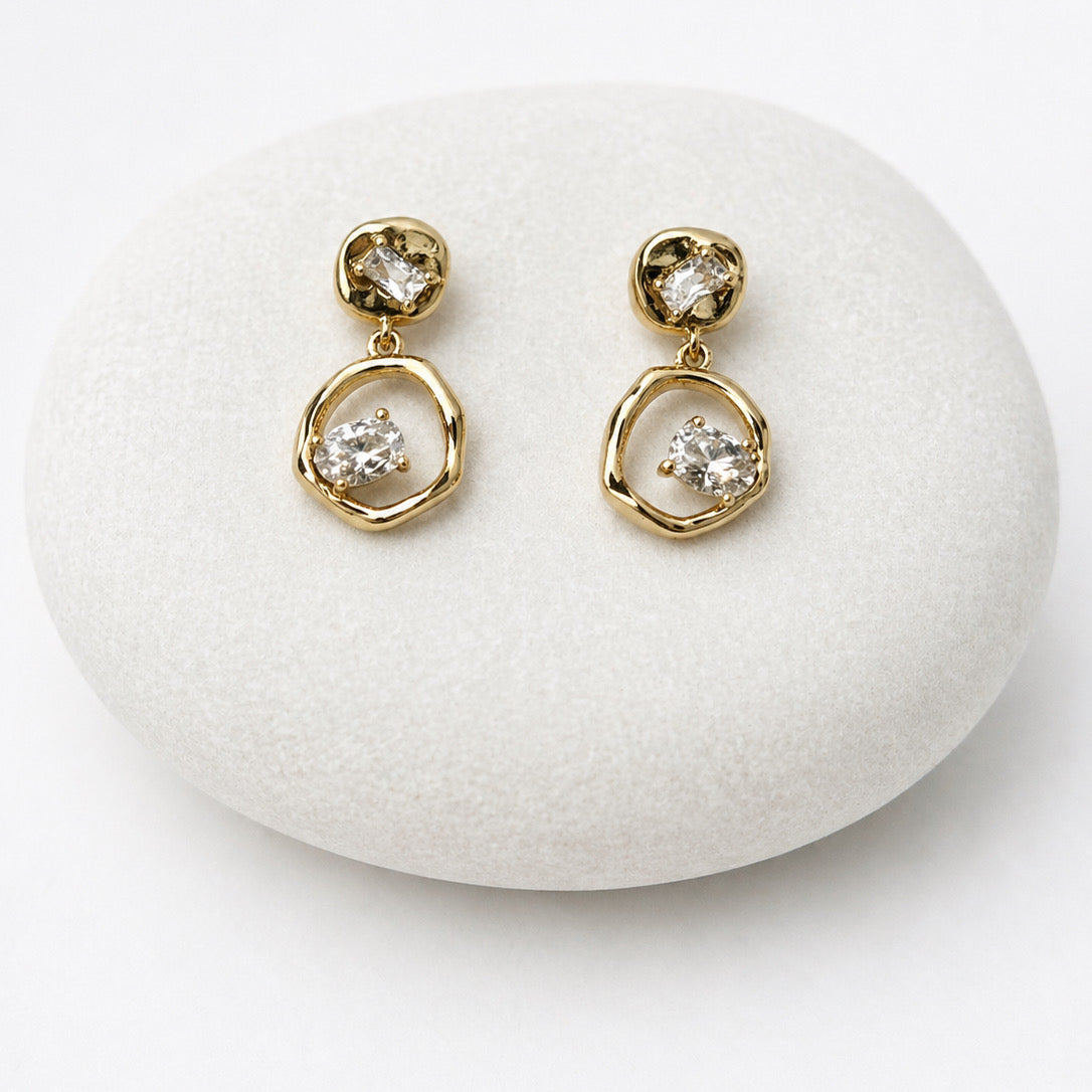 Gold earrings with clear gemstones