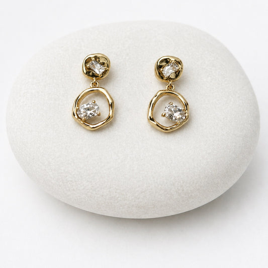 Gold earrings with clear gemstones
