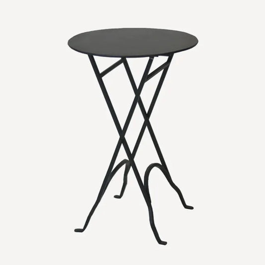 A black round folding side table made of iron