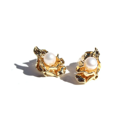 Pair of gold earrings with pearl centers