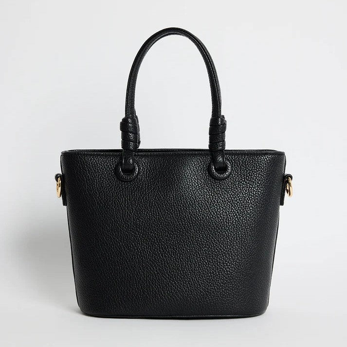 Black textured handbag on a light gray background