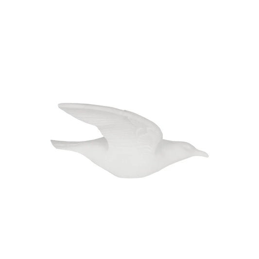 A white fine bone china bird wall art in a flying pose.