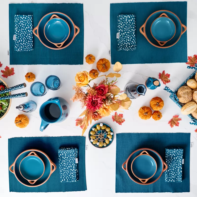 Table setting with blue and orange Terracotta bowls