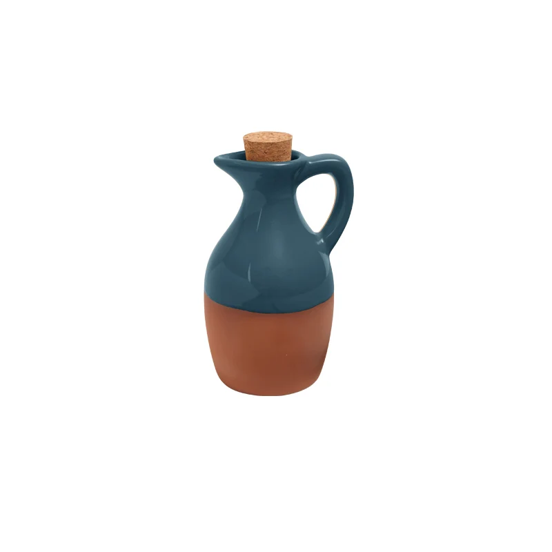 A terracotta oil drizzlier with cork lid 
