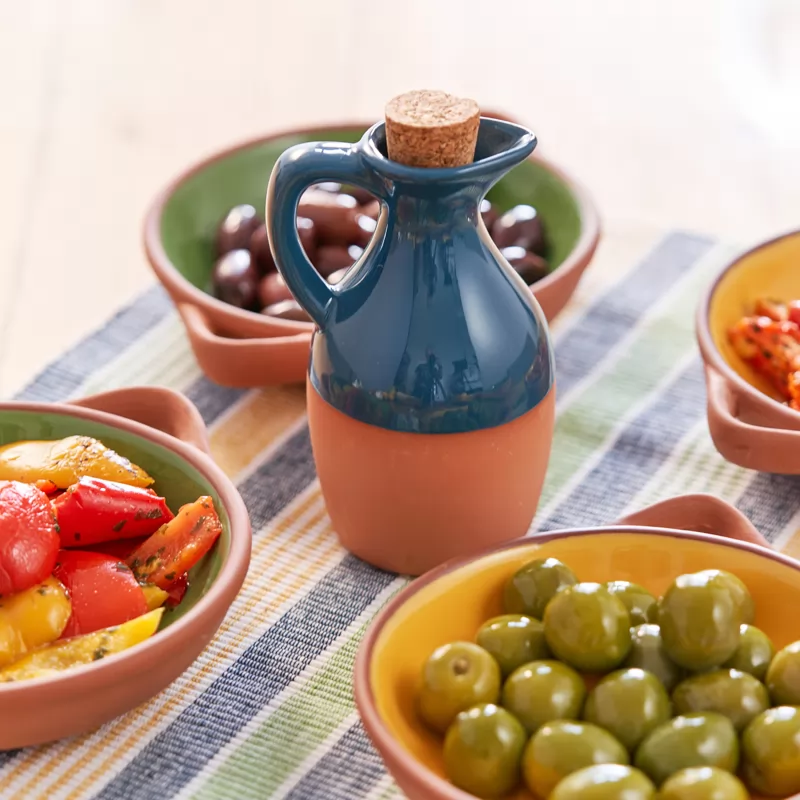 A small oil dispenser made from terracotta 