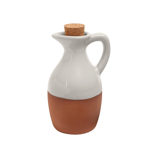 A white glazed terracotta oil dispenser 