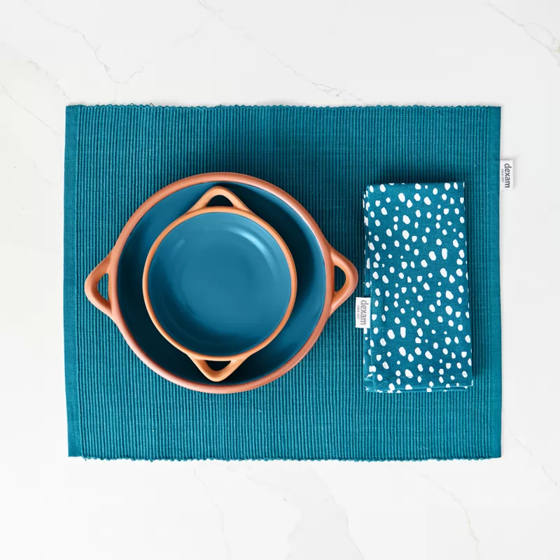 Two different sized blue glazed terracotta dishes 