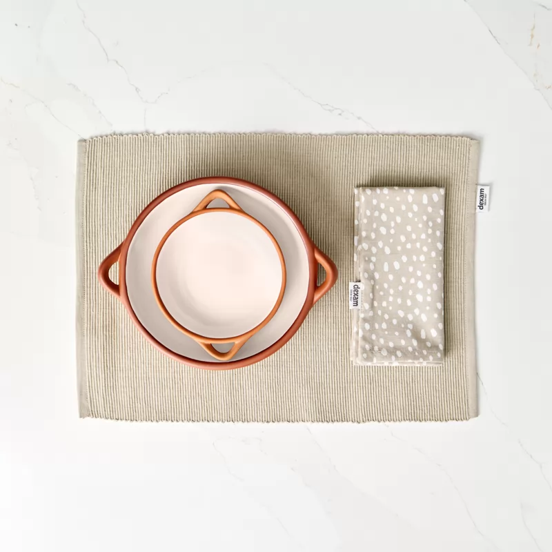 A set of terracotta dishes inside each other of different shapes 