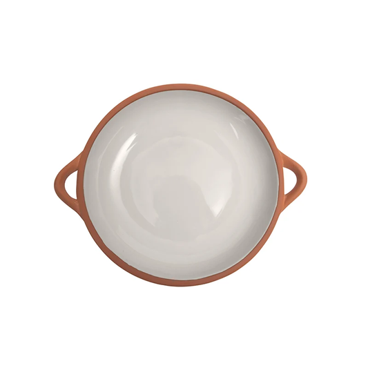 A large shallow terracotta dish glazed in stone coloring 