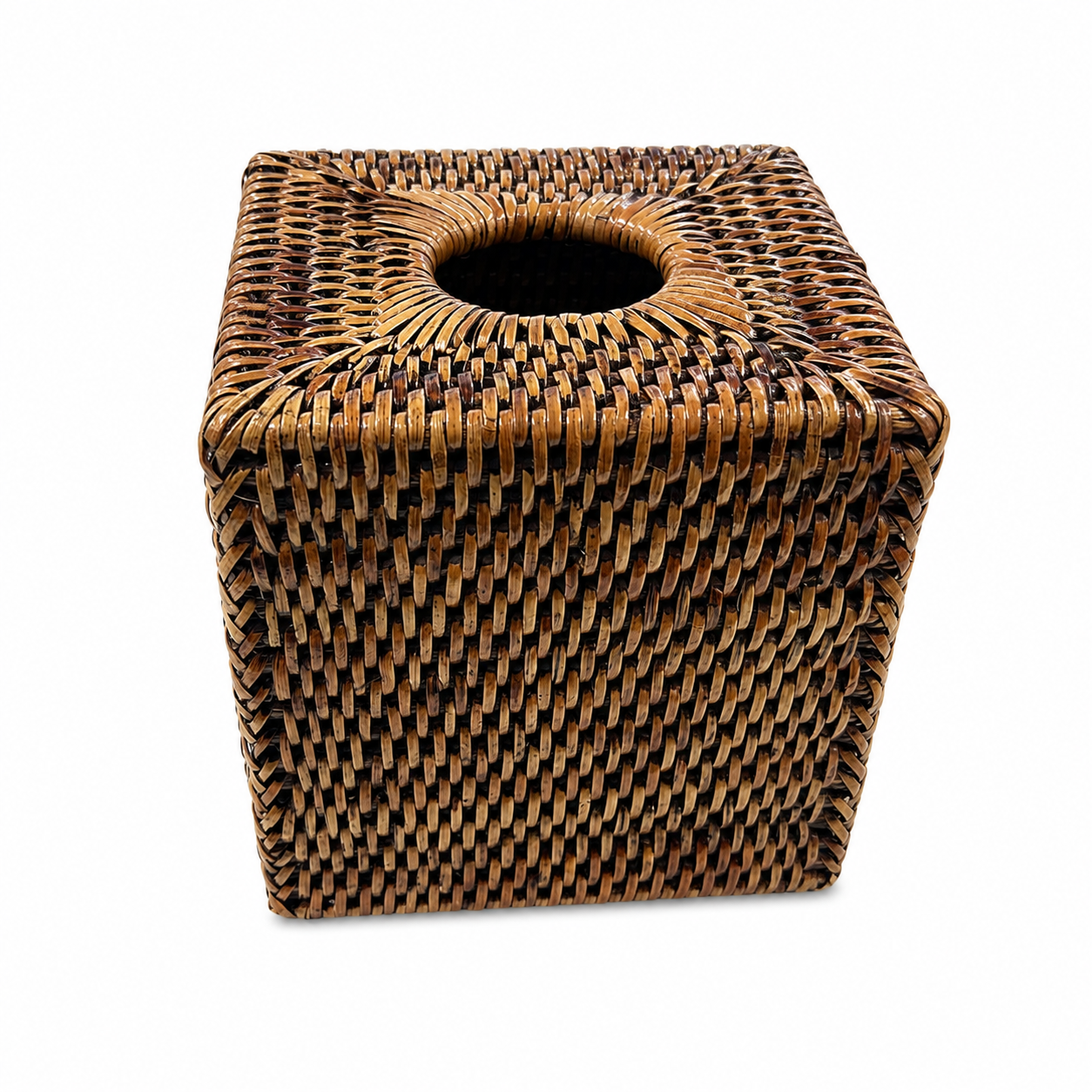 A square woven rattan or wicker tissue box cover with a circular opening at the top,