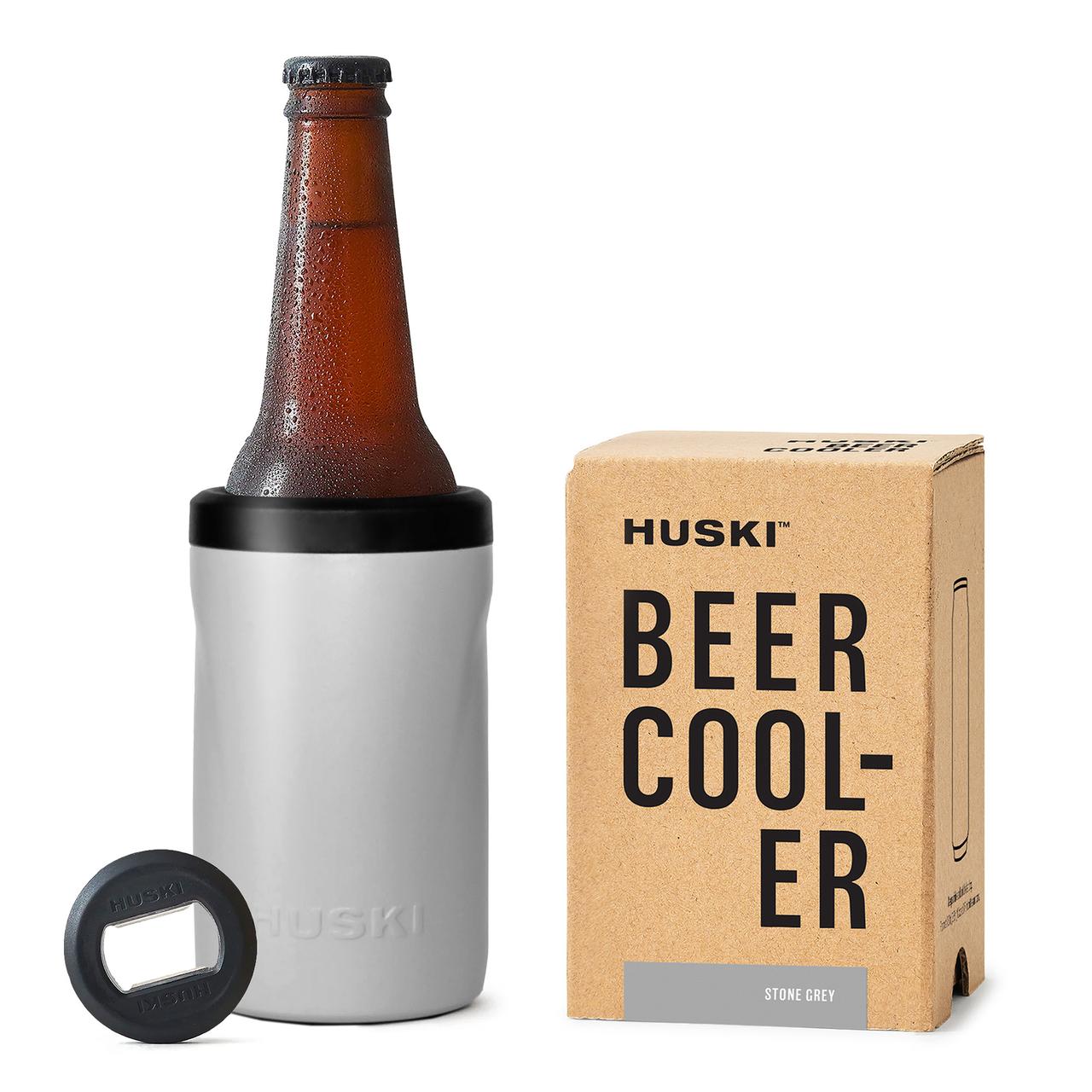 A powder pink Huski Short Tumbler 2.0 next to its packaging box, with the product name and the brand Huski visible on the box.