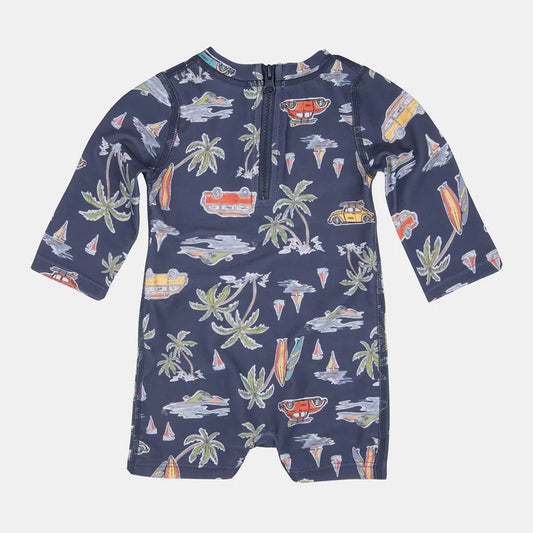 A long sleeve baby togs/ swimwear with a tropical print design, featuring a high neckline and bottom opening press studs.