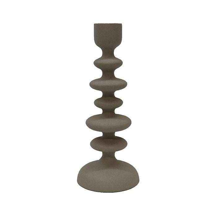 A textured off white aluminium candlestick with a contemporary design, featuring a series of circular rings at varying diameters, leading up to a narrow top.