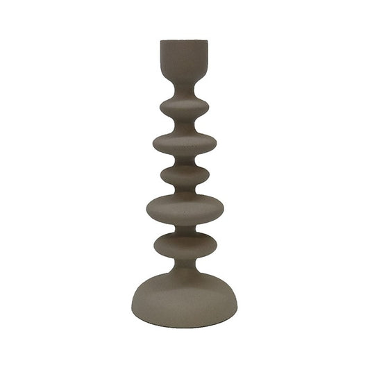 A textured off white aluminium candlestick with a contemporary design, featuring a series of circular rings at varying diameters, leading up to a narrow top.