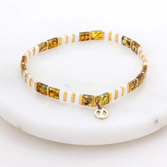 Pearl bracelet with a gold charm