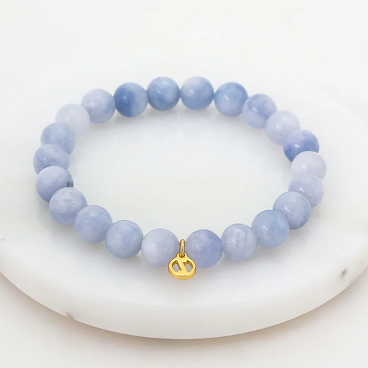 Pearl bracelet with a gold charm