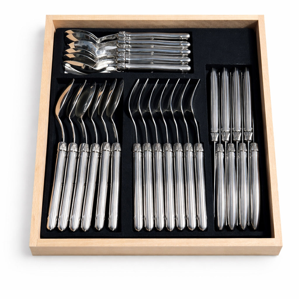 Set of silver forks in a wooden box 