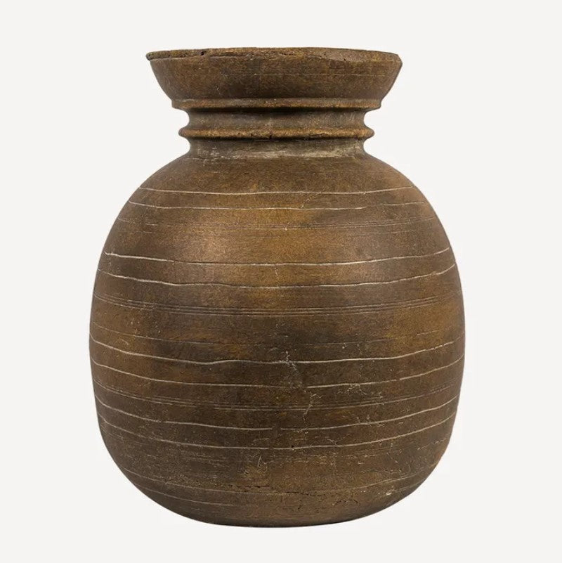 A large, round, brown terracotta vessel suitable for flowers, with a rustic design.