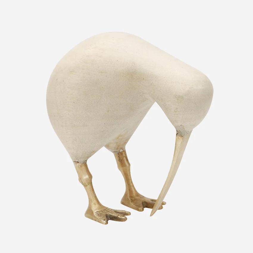 A decorative sculpture of a kiwi bird with a textured off-white body and brass gold legs, 