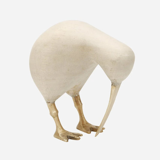 A decorative sculpture of a kiwi bird with a textured off-white body and brass gold legs, 
