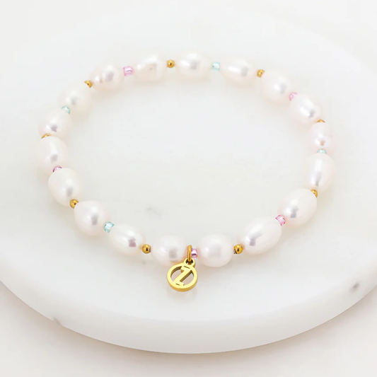 Pearl bracelet with colorful beads and a gold charm