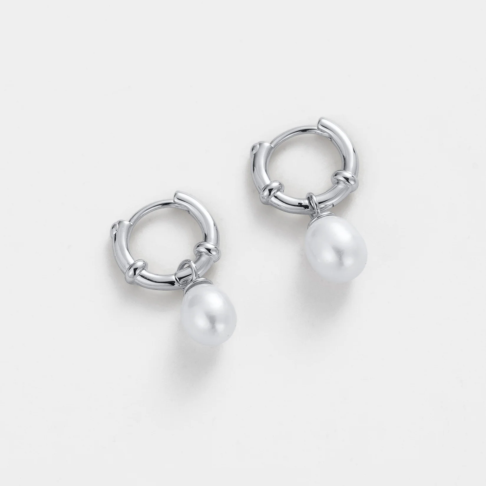 Silver hoop earrings with pearl charms