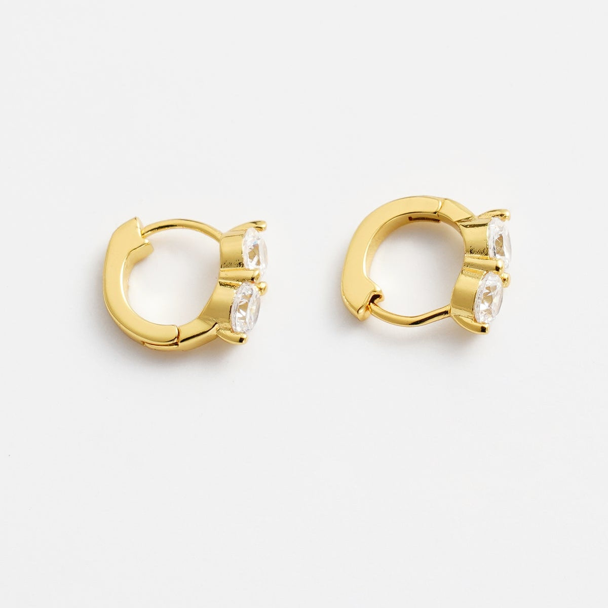 Gold huggies with stone 