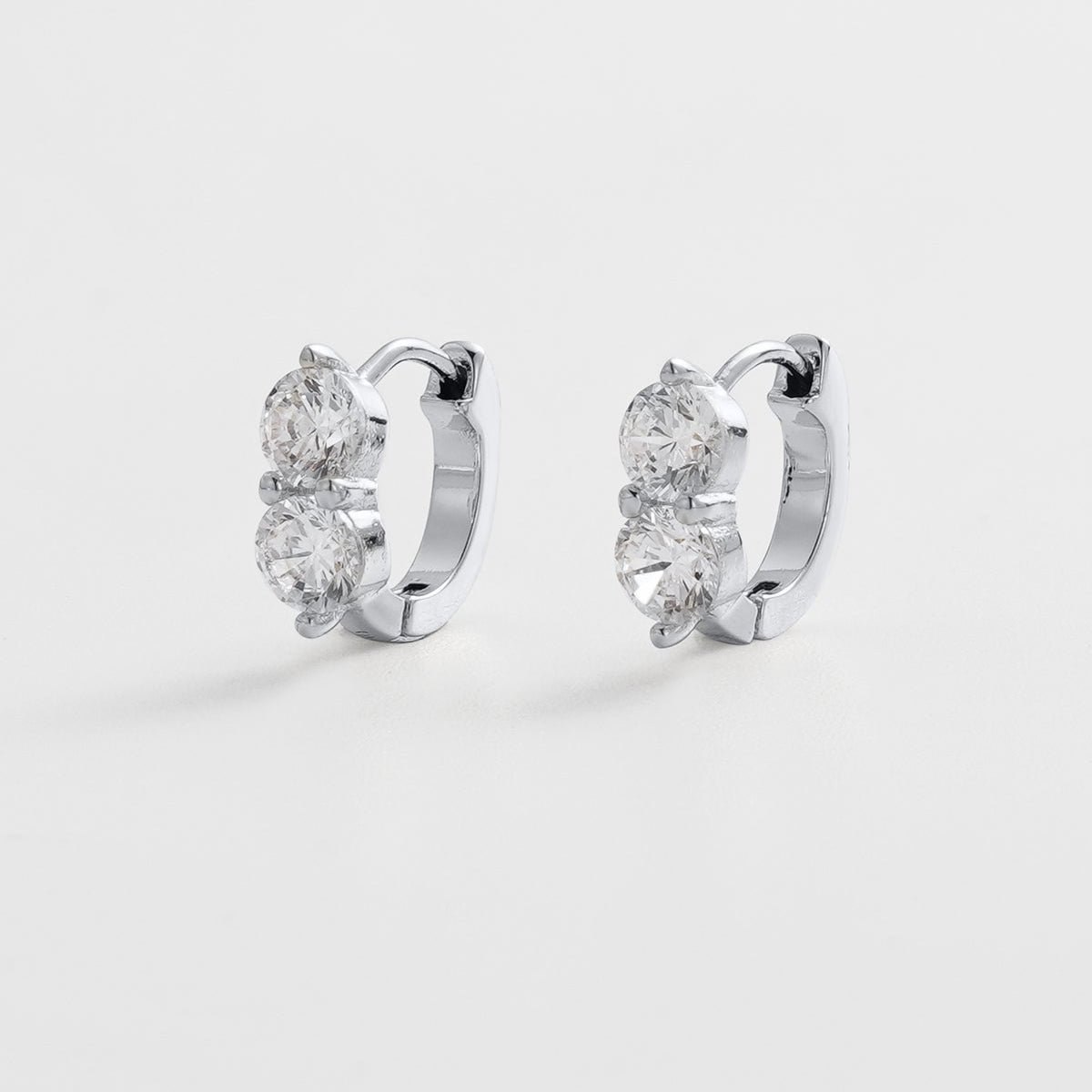 Silver huggie earrings with stones at front 