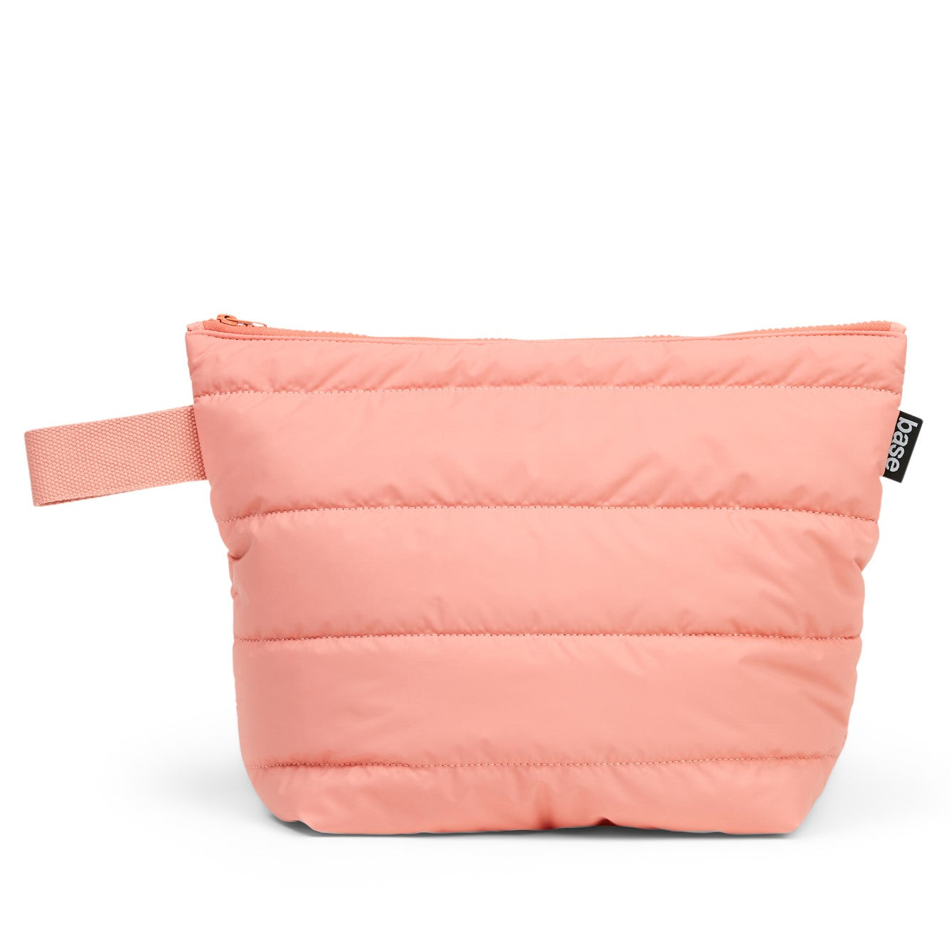 A pink cloud-like fabric toiletry bag with a soft padded interior, featuring a chunky top zip closure and a soft cotton carry loop.